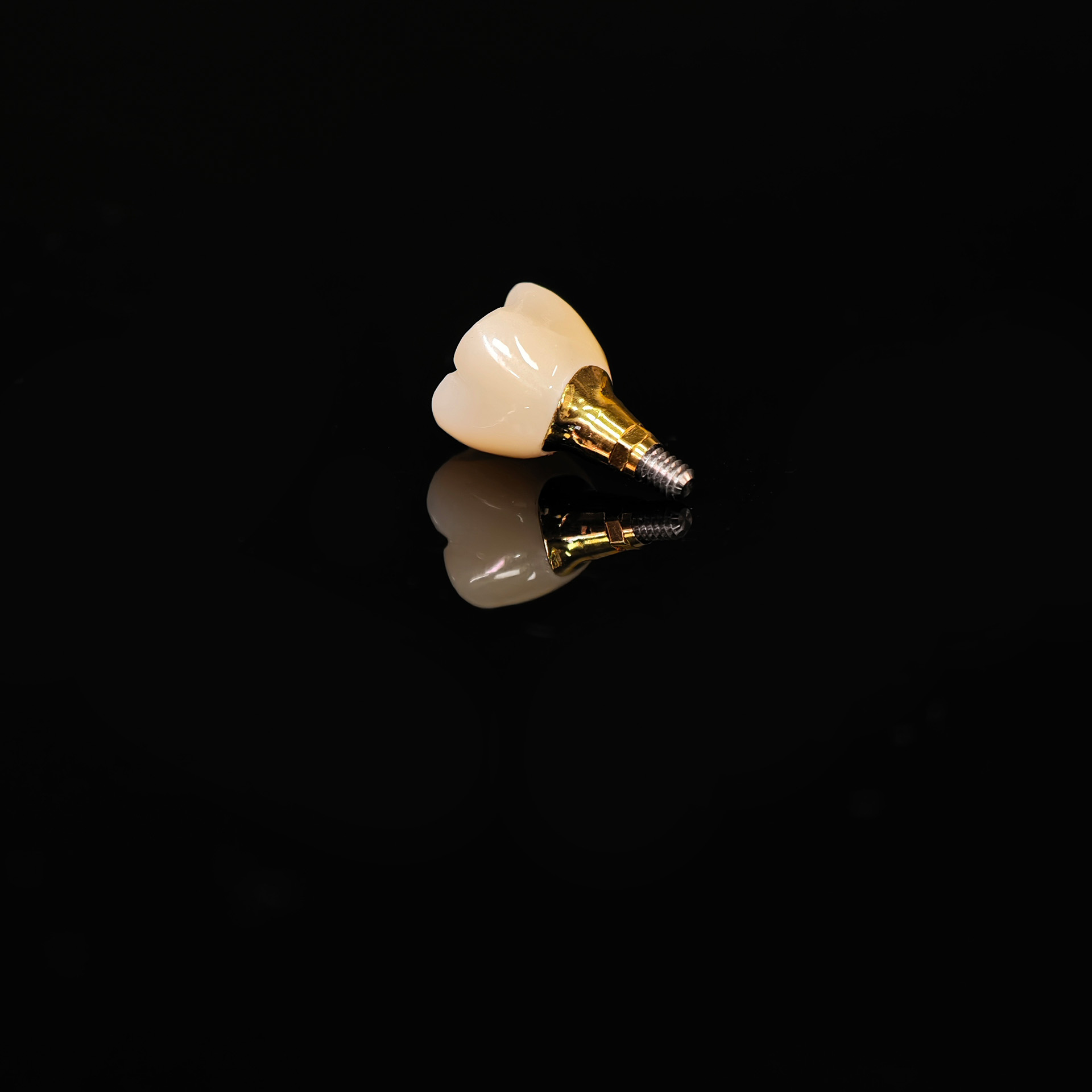 Zirconia implant crown with gold plating