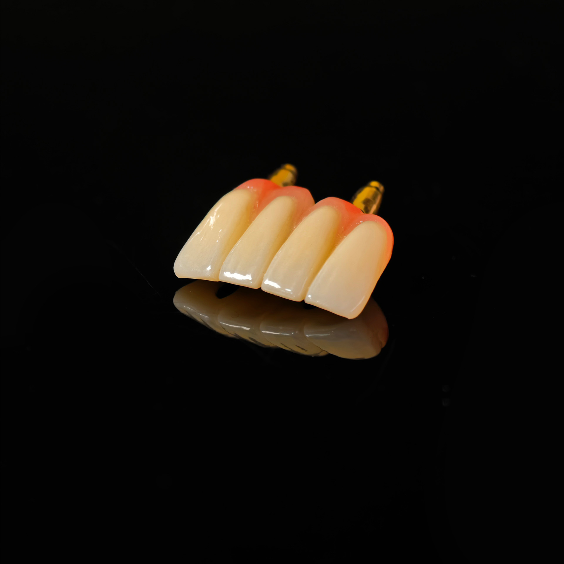 Zirconia implant bridge with gold platin