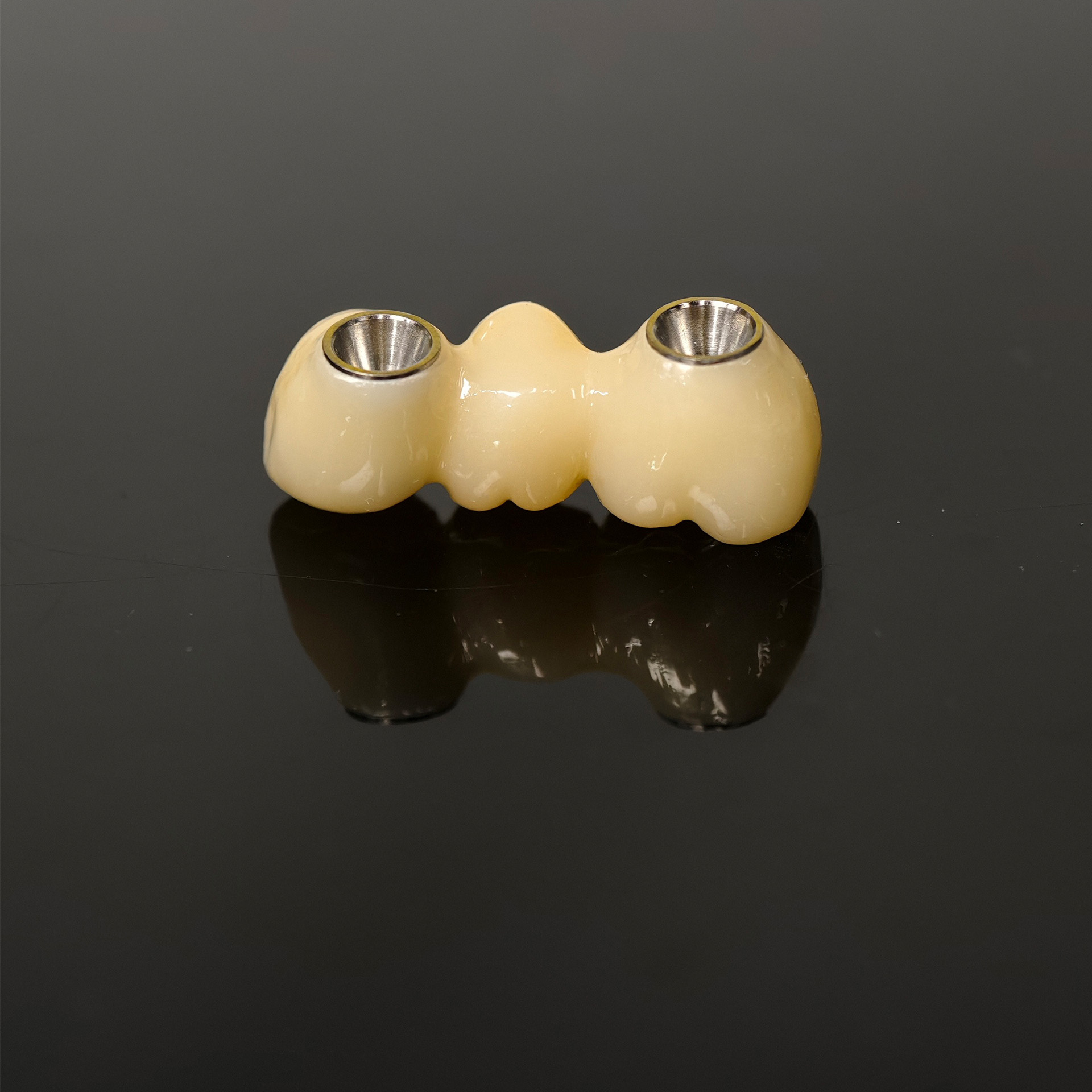 Zirconia bridge with ti-base screw retai